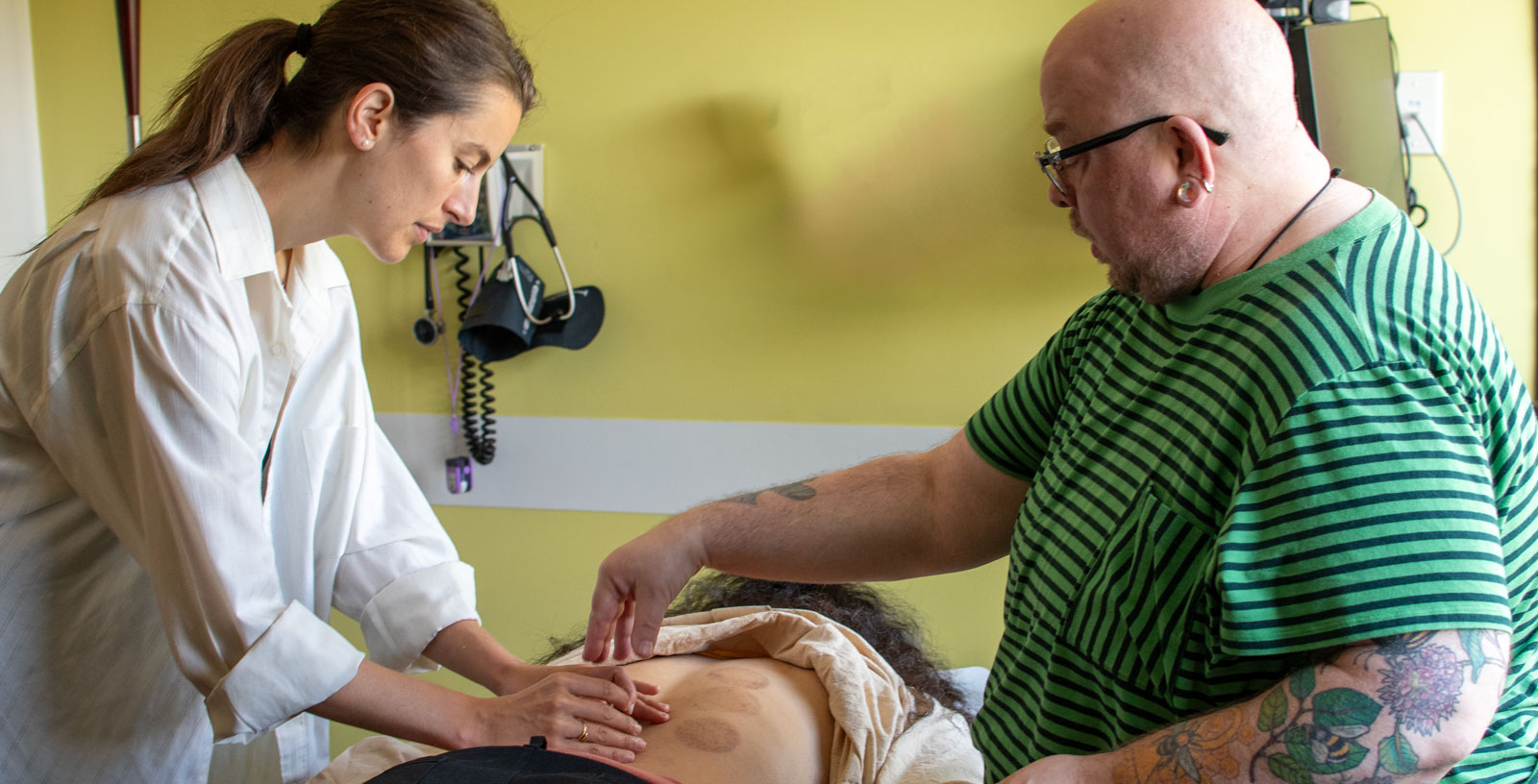 doctor and student doing acupuncture